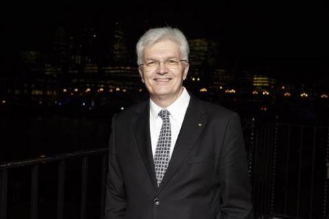 Image of Glyn Davis with a night time city backdrop